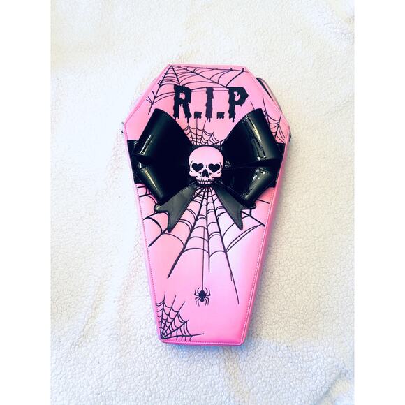 Dolls Kill Pink coffin backpack